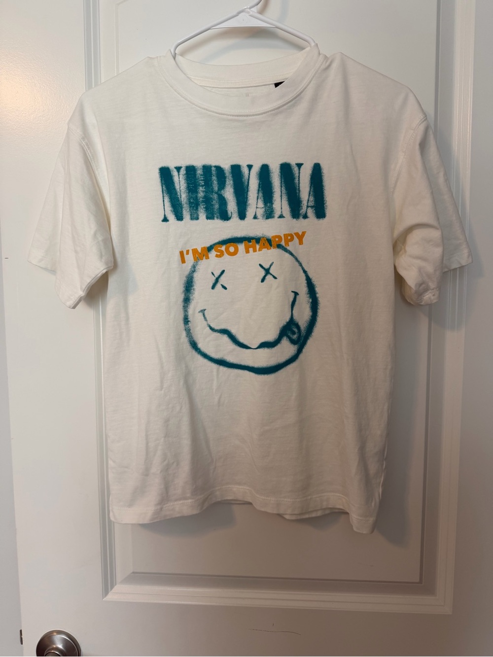 Zara White Tee with Teal Nirvana Graphic and Orange Text